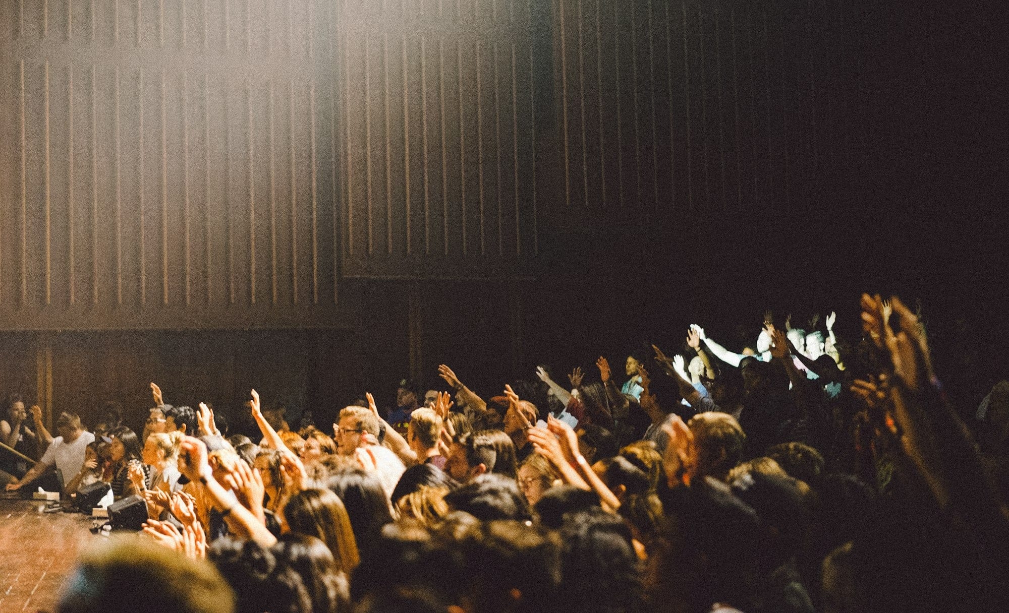 people raising their hands